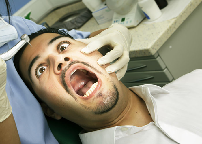 apprehensive dental patient as the drill comes near